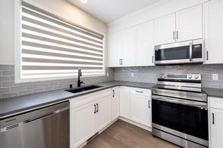 Photo 11: 146 Wolf Creek Rise SE in Calgary: C-281 Detached for sale : MLS®# A2115372