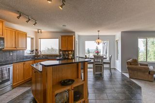 Photo 4: 7771 Springbank Way SW in Calgary: Springbank Hill Detached for sale : MLS®# A2058722