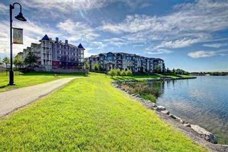 Photo 2: 411 108 Country Village Circle NE in Calgary: Country Hills Village Apartment for sale : MLS®# A1218608
