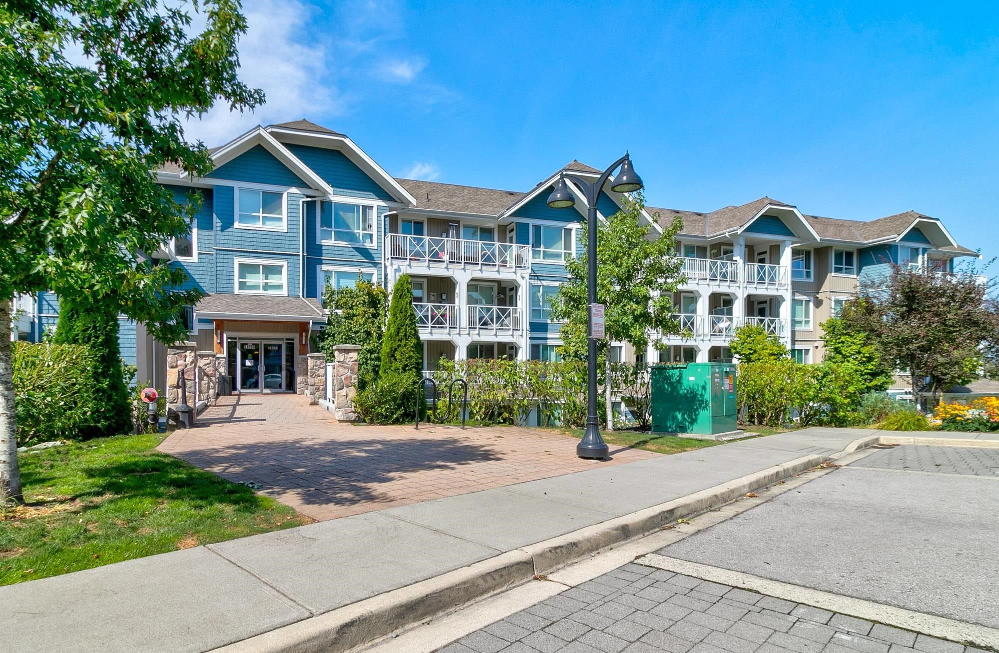Main Photo: 206 16380 64 Avenue in Surrey: Cloverdale BC Condo for sale in "The Ridge at Bose Farms" (Cloverdale)  : MLS®# R2720621