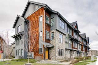 Photo 1: 304 Ascot Circle SW in Calgary: Aspen Woods Row/Townhouse for sale : MLS®# A1217542