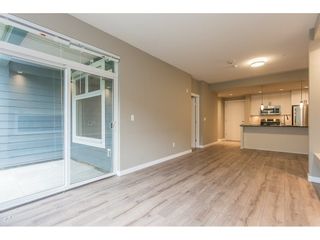 Photo 3: 104 2238 WHATCOM Road in Abbotsford: Abbotsford East Condo for sale in "Waterleaf" : MLS®# R2260128