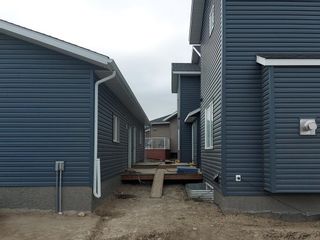 Photo 5: 54 Rivercrest Common: Cochrane Semi Detached (Half Duplex) for sale : MLS®# A2008166