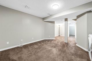 Photo 16: 13 Woodhill Court SW in Calgary: Woodlands Row/Townhouse for sale : MLS®# A1209374