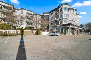 Photo 1: 113 5765 GLOVER Road in Langley: Langley City Condo for sale in "COLLEGE COURT" : MLS®# R2661071