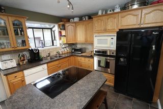 Photo 4: 64 STRATHCONA Close SW in Calgary: Strathcona Park House for sale : MLS®# C4142880