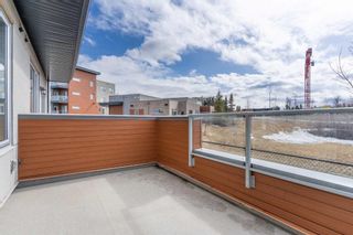 Photo 33: 107 Shawnee Common SW SW in Calgary: Shawnee Slopes Row/Townhouse for sale : MLS®# A2120063