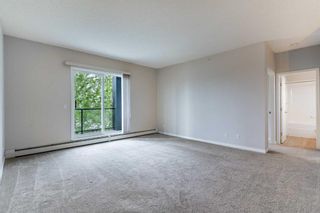 Photo 11: 316 2022 Canyon Meadows Drive SE in Calgary: Queensland Apartment for sale : MLS®# A2059840
