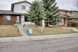 Photo 1: 329 Woodvale Crescent SW in Calgary: Woodlands Semi Detached for sale : MLS®# A1093334