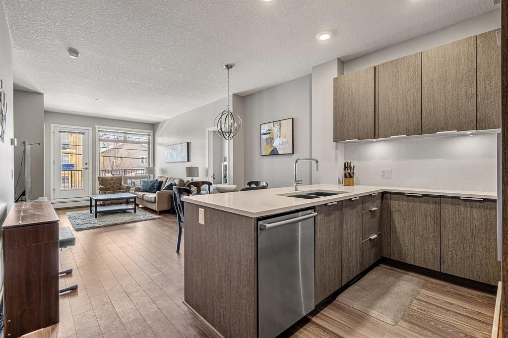 Main Photo: 218 823 5 Avenue NW in Calgary: Sunnyside Apartment for sale : MLS®# A2031570