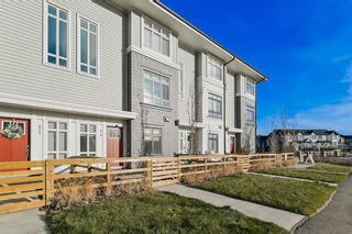 Photo 1: 410 210 Avenue SW in Calgary: Belmont Row/Townhouse for sale : MLS®# A2094526