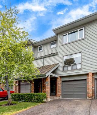 Main Photo: 119 Point Drive NW in Calgary: Point McKay Row/Townhouse for sale : MLS®# A2134442
