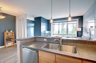 Photo 17: 1 108 Rockyledge View NW in Calgary: Rocky Ridge Row/Townhouse for sale : MLS®# A1234759