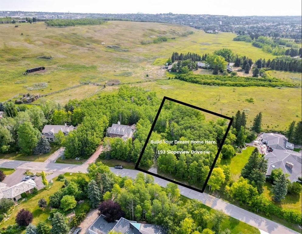 193 Slopeview Dr. SW. Build your dream home on a huge, nearly an acre treed lot in this idyllic location close to shopping, transit, great schools but beautifully serene and peaceful.