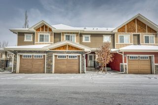 Photo 1: 11 West Coach Manor SW in Calgary: West Springs Row/Townhouse for sale : MLS®# A2035861