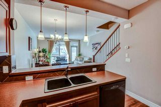 Photo 4: 4 156 Rockyledge View NW in Calgary: Rocky Ridge Row/Townhouse for sale : MLS®# A2120202