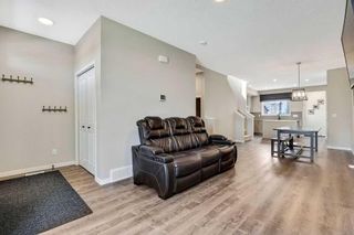 Photo 4: 225 Creekside Boulevard SW in Calgary: C-168 Semi Detached (Half Duplex) for sale : MLS®# A2062382