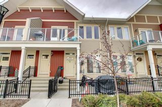 Photo 1: 128 Auburn Meadows Walk SE in Calgary: Auburn Bay Row/Townhouse for sale : MLS®# A1203356
