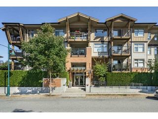 Photo 1: 211 500 KLAHANIE Drive in Port Moody: Port Moody Centre Condo for sale in "TIDES" : MLS®# R2587410