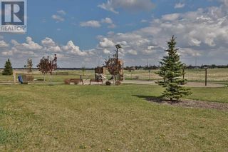 Photo 36: 11 Canyon Meadows Bend W in Lethbridge: House for sale : MLS®# A2076078