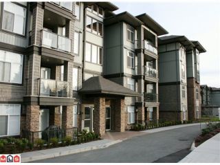 Photo 1: 107 2068 SANDALWOOD Crescent in Abbotsford: Central Abbotsford Condo for sale in "THE STERLING" : MLS®# F1018946