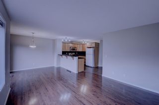 Photo 4: 151 Panatella Drive NW in Calgary: Panorama Hills Semi Detached (Half Duplex) for sale : MLS®# A1254576