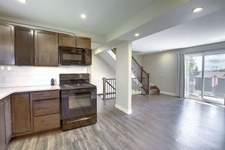 Photo 6: 9 1603 MCGONIGAL Drive NE in Calgary: Mayland Heights Row/Townhouse for sale : MLS®# A1015179