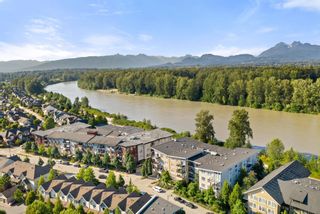 Photo 1: 401 23255 BILLY BROWN Road in Langley: Fort Langley Condo for sale in "Waterfront at Bedford Landing" : MLS®# R2706918