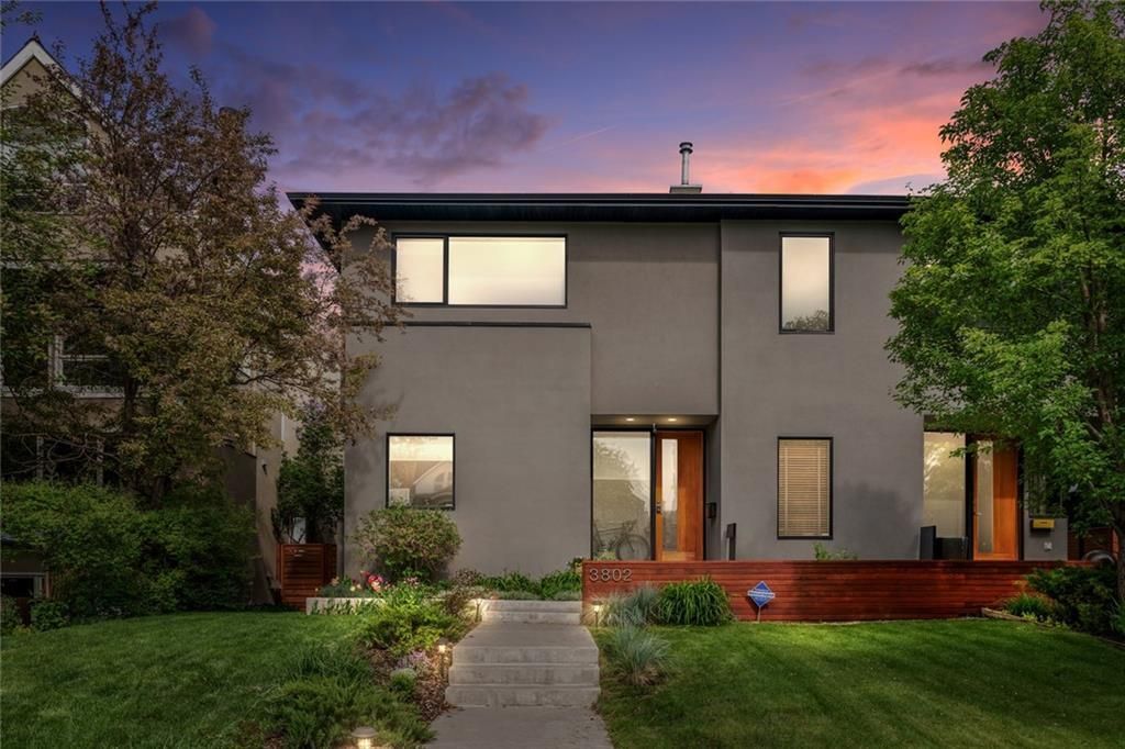 Designed by Architect John Brown, this modern family home sits atop the ridge on tree lined 1A Street in Parkhill.