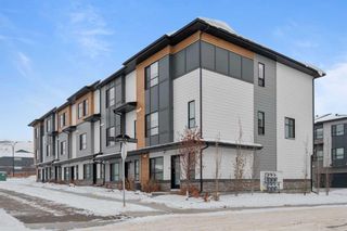 Photo 1: 34 Cranbrook Gardens SE in Calgary: Cranston Row/Townhouse for sale : MLS®# A2103164