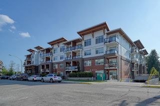 Photo 1: 415 5415 BRYDON Crescent in Langley: Langley City Condo for sale in "THE AUDLEY" : MLS®# R2781160