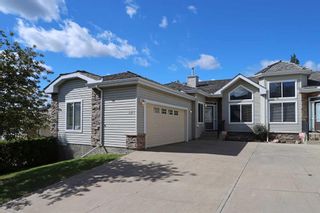 Photo 1: 421 Rocky Vista Gardens NW in Calgary: Rocky Ridge Semi Detached (Half Duplex) for sale : MLS®# A2143870