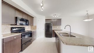 Photo 8: 3111 WHITELAW Drive in Edmonton: Zone 56 House Half Duplex for sale : MLS®# E4376578