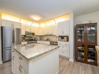 Photo 7: 124 7229 Sierra Morena Boulevard SW in Calgary: Signal Hill Apartment for sale : MLS®# A2035399