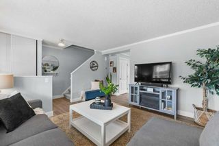 Photo 2: 563 Queenston Gardens SE in Calgary: Queensland Row/Townhouse for sale : MLS®# A2126181