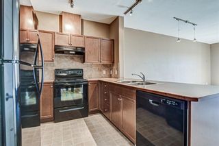 Photo 4: 1407 92 CRYSTAL SHORES Road: Okotoks Apartment for sale : MLS®# A1222250