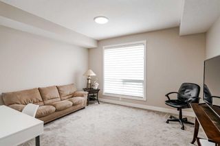 Photo 33: 409 15 Cougar Ridge Landing SW in Calgary: Patterson Apartment for sale : MLS®# A2127724