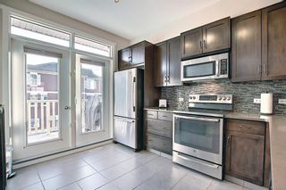 Photo 11: 50 Evansview Road NW in Calgary: Evanston Row/Townhouse for sale : MLS®# A1078520
