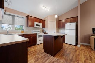 Photo 4: 1298 23 Avenue: Didsbury Semi Detached (Half Duplex) for sale : MLS®# A1250896