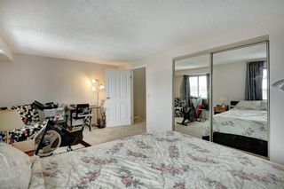 Photo 17: 143 Woodvale Bay SW in Calgary: Woodlands Row/Townhouse for sale : MLS®# A2022754