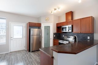 Photo 5: 103 703 Luxstone Square SW: Airdrie Row/Townhouse for sale : MLS®# A2122447