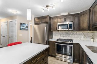 Photo 10: 907 Cranbrook Walk SE in Calgary: Cranston Row/Townhouse for sale : MLS®# A2125451