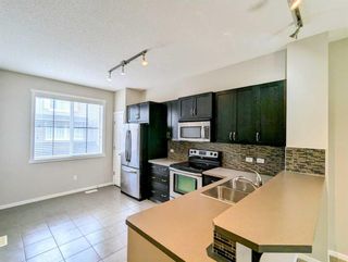 Photo 3: 2109 125 Panatella Way NW in Calgary: Panorama Hills Row/Townhouse for sale : MLS®# A2130080