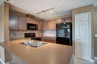 Photo 2: 1208 92 Crystal Shores Road: Okotoks Apartment for sale : MLS®# A1089465