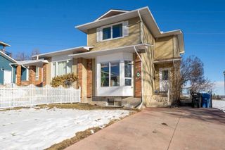 Main Photo: 68 Stradwick Rise SW in Calgary: Strathcona Park Semi Detached (Half Duplex) for sale : MLS®# A2109365