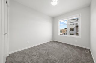 Photo 21: 50 Cranbrook Gardens SE in Calgary: Cranston Row/Townhouse for sale : MLS®# A2037909