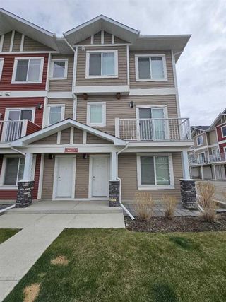 Photo 1: 17 Redstone Circle NE in Calgary: Redstone Row/Townhouse for sale : MLS®# A2130894