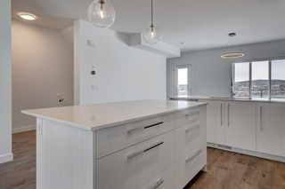 Photo 4: 198 Creekstone Drive SW in Calgary: C-168 Row/Townhouse for sale : MLS®# A2115444