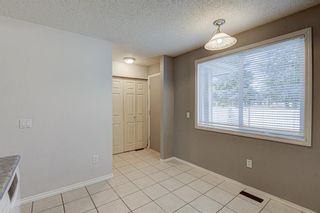 Photo 11: 323 Queenston Heights SE in Calgary: Queensland Row/Townhouse for sale : MLS®# A1203860