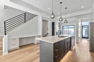 Photo 9: 420 24 Avenue NE in Calgary: Winston Heights/Mountview Semi Detached (Half Duplex) for sale : MLS®# A2115046